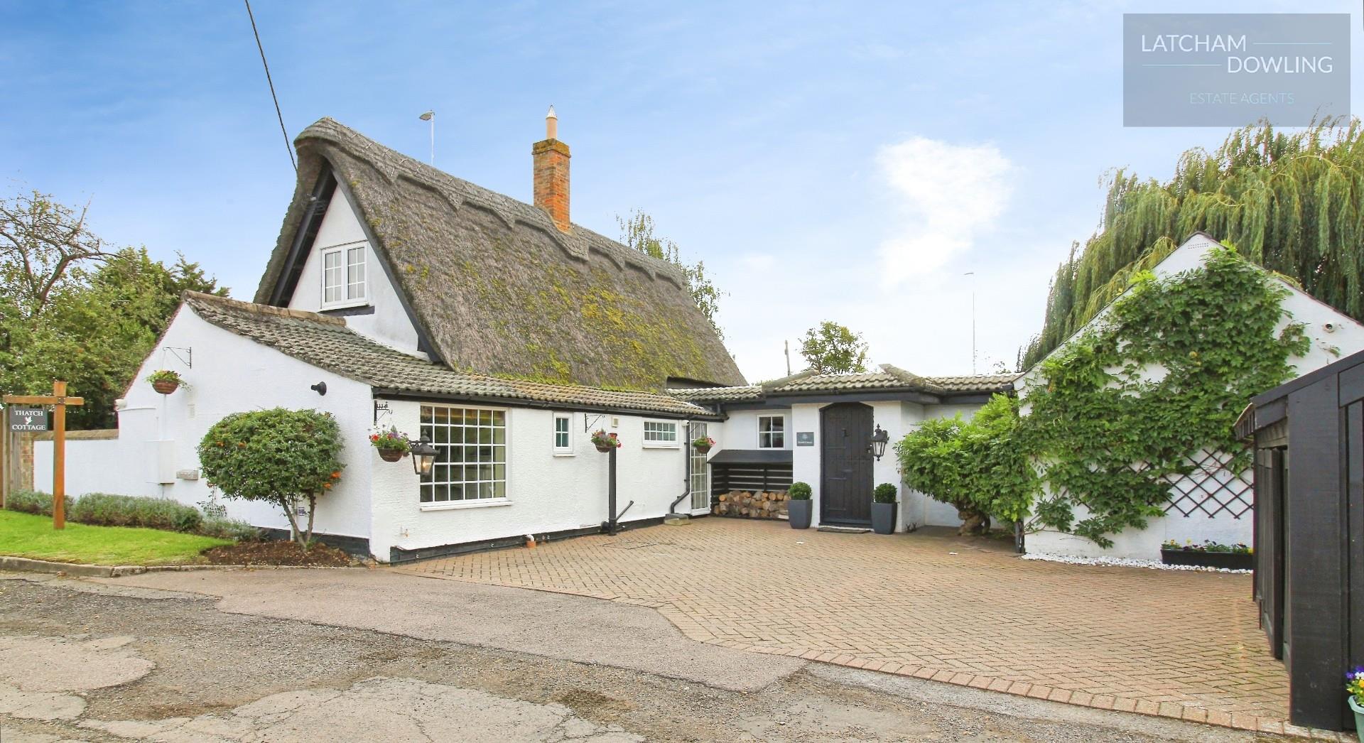 Thatch Cottage Blue Sky.jpg