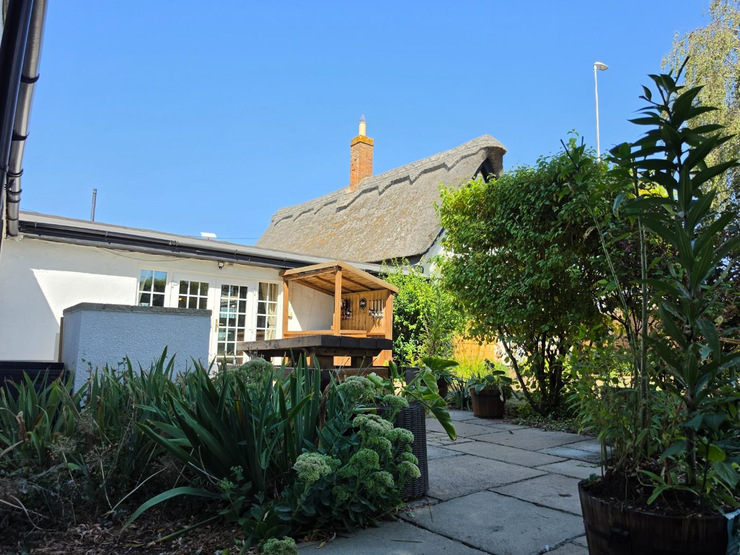 Thatch Cottage Summer Patio.jpg